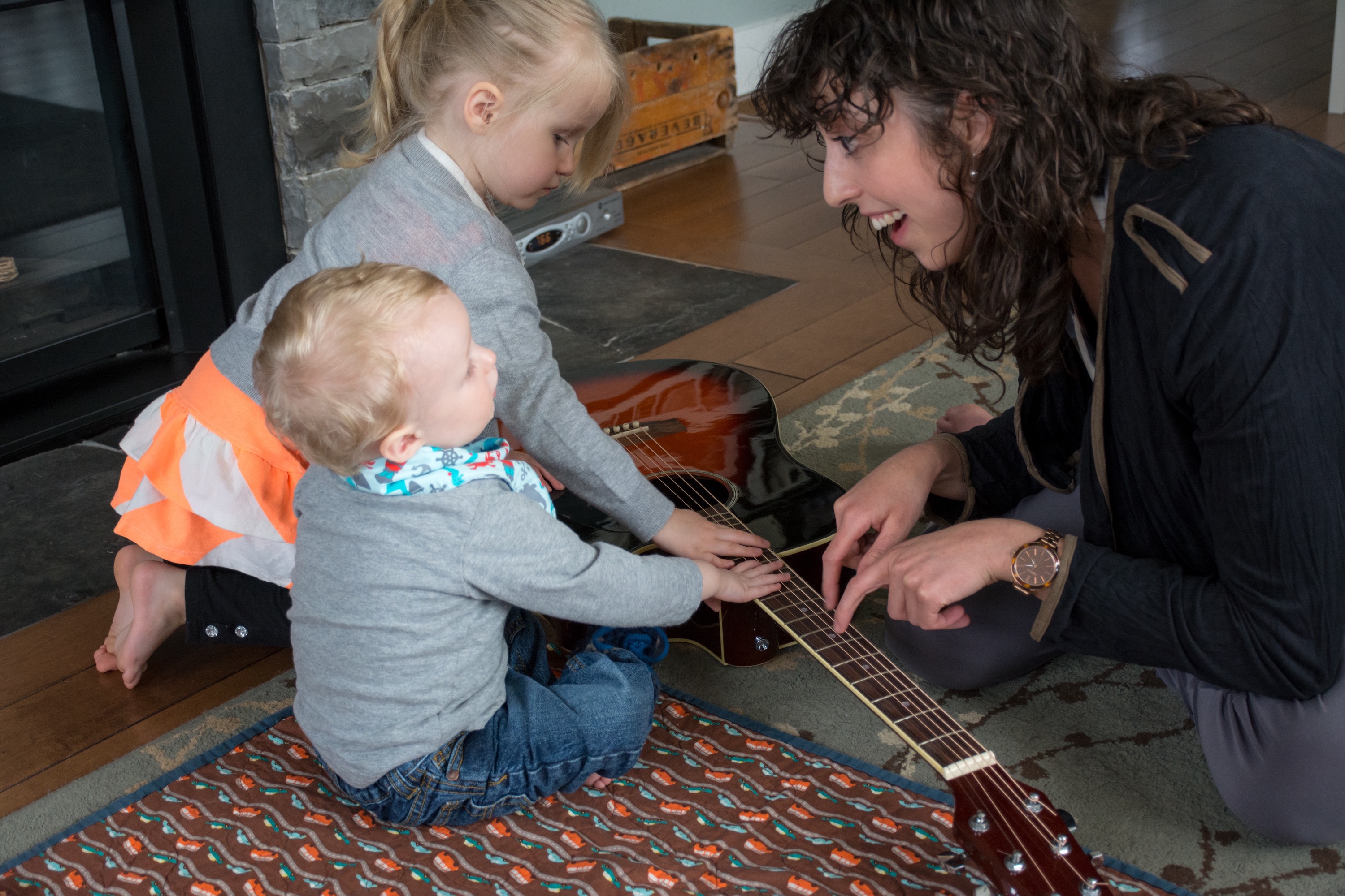 Children. Infants. Guitar. Playing Instruments. Smiling. Laughing. Find Your Voice Music Therapy. Kingston, Ontario. Halifax, Nova Scotia. Mackenzie Costron. Accredited Music Therapist. Registered Counselling Therapist.